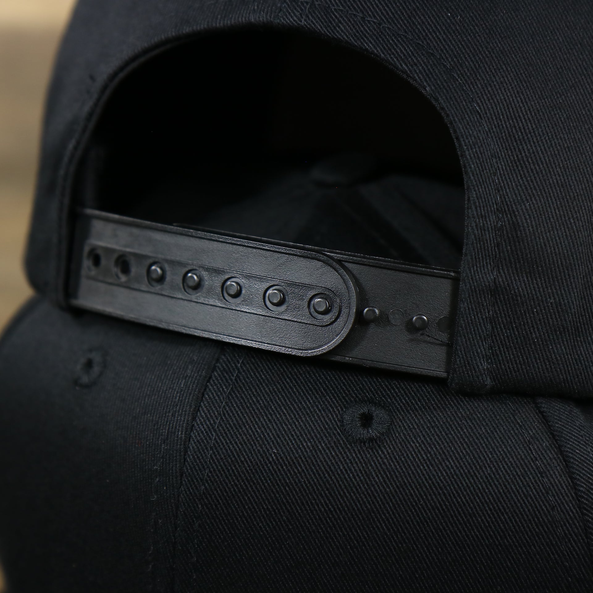 The Black Adjustable Strap on the Youth Jet Black Flat Brim Gray Bottom Blank Snapback Cap | Kid’s Black Snap Cap
