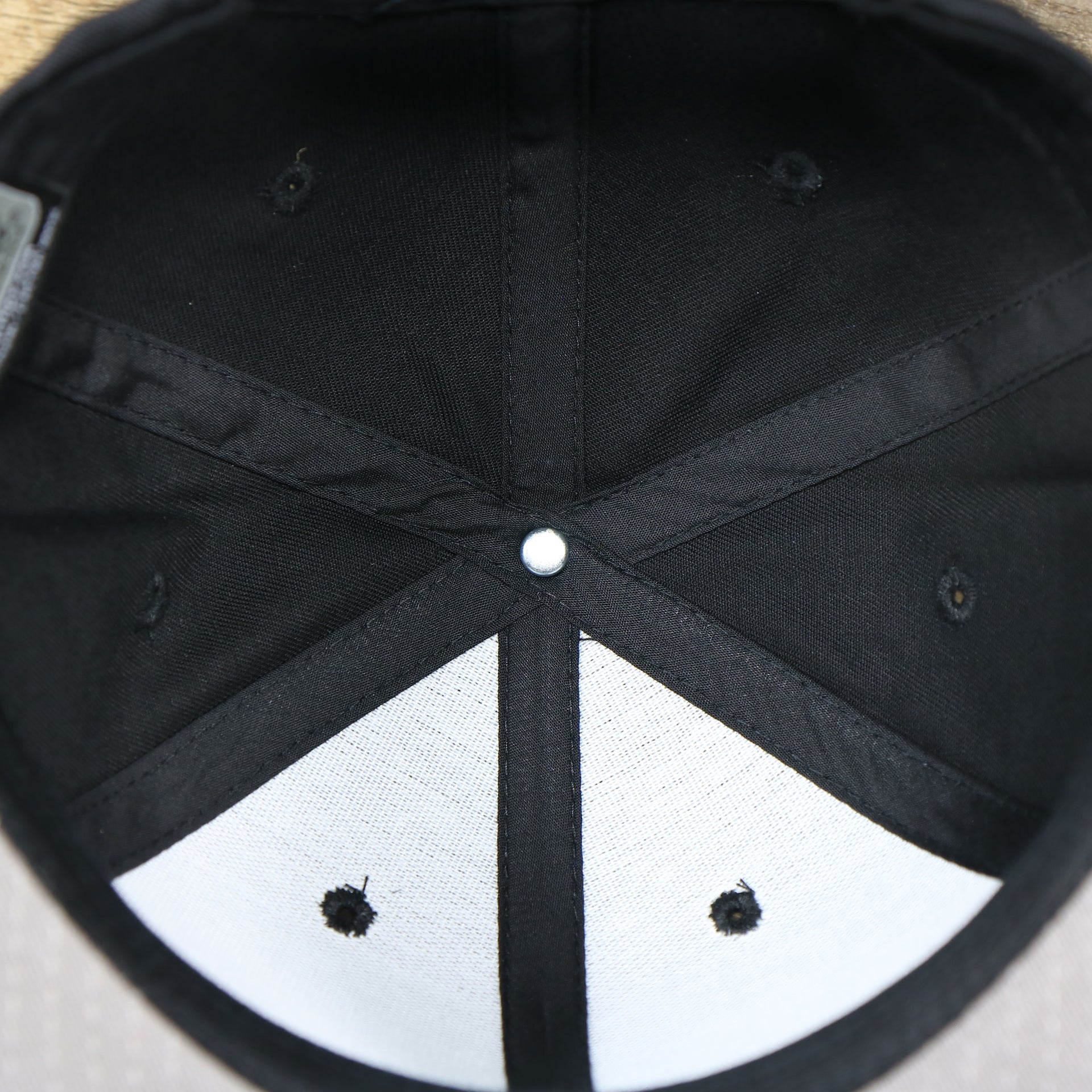 The inside of the Youth Jet Black Flat Brim Gray Bottom Blank Snapback Cap | Kid’s Black Snap Cap