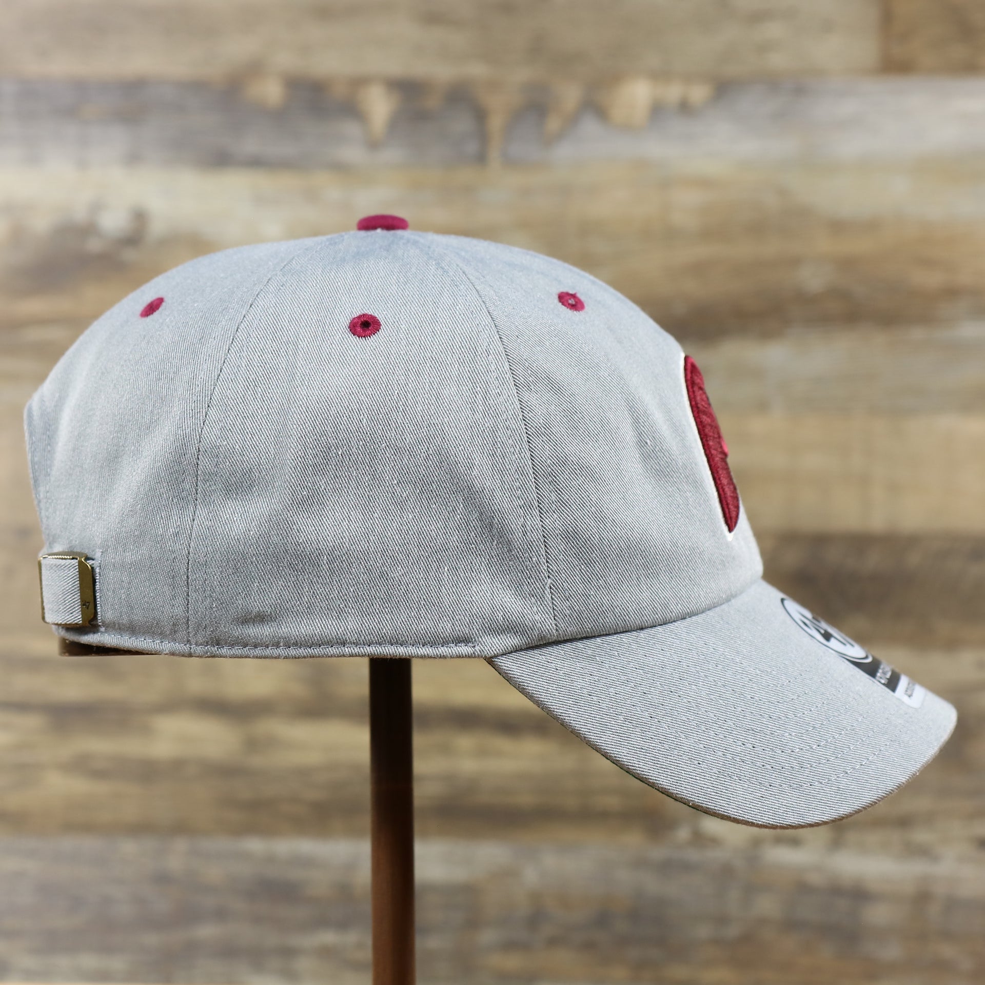 The wearer's right on the Cooperstown Phillies Logo Green Bottom Philadelphia Phillies Dad Hat | Gray Dad Hat