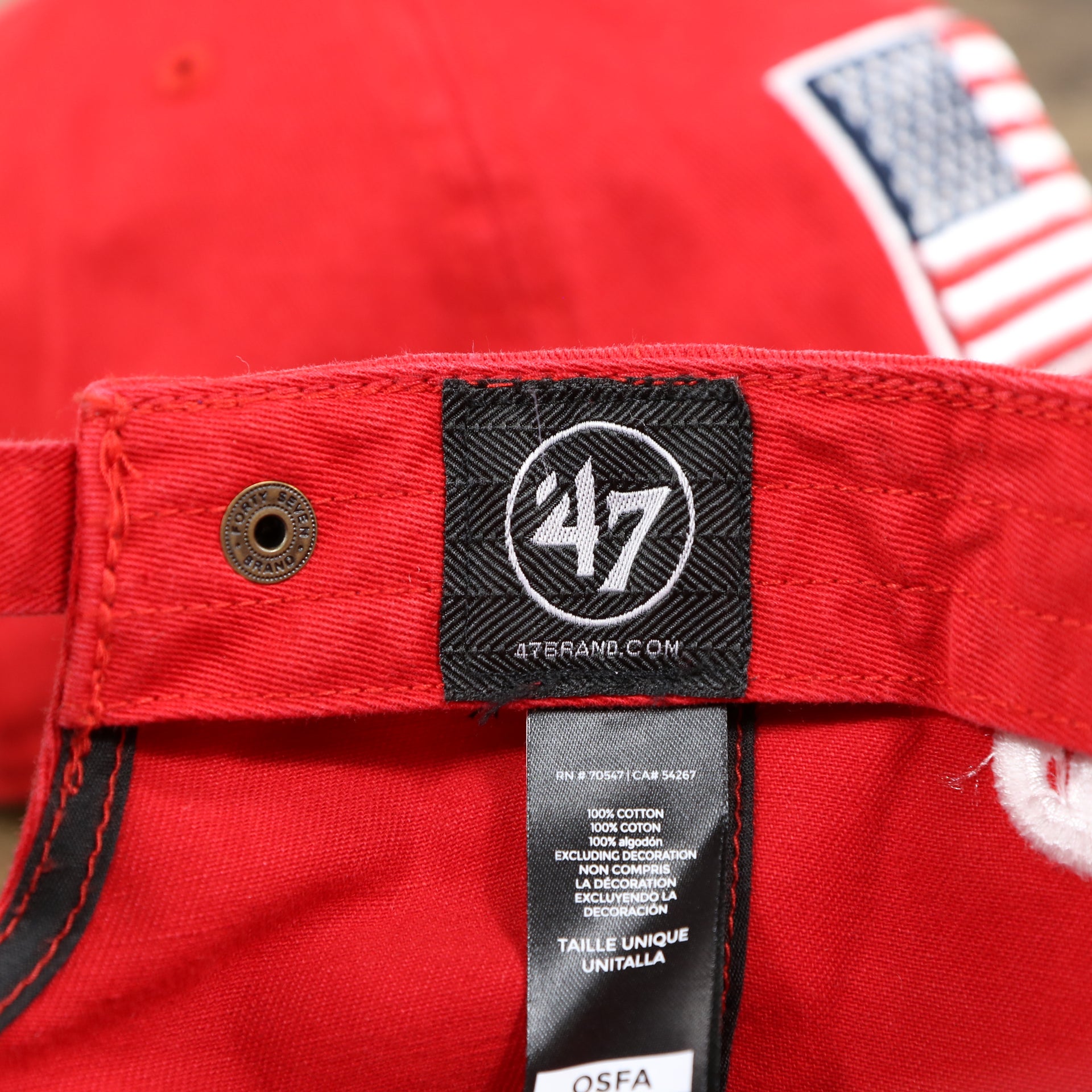 The 47 brand tag on the Philadelphia Phillies SIde Patch USA Flag Front Logo Stars And Stripes Dad Hat | Red Dad Hat