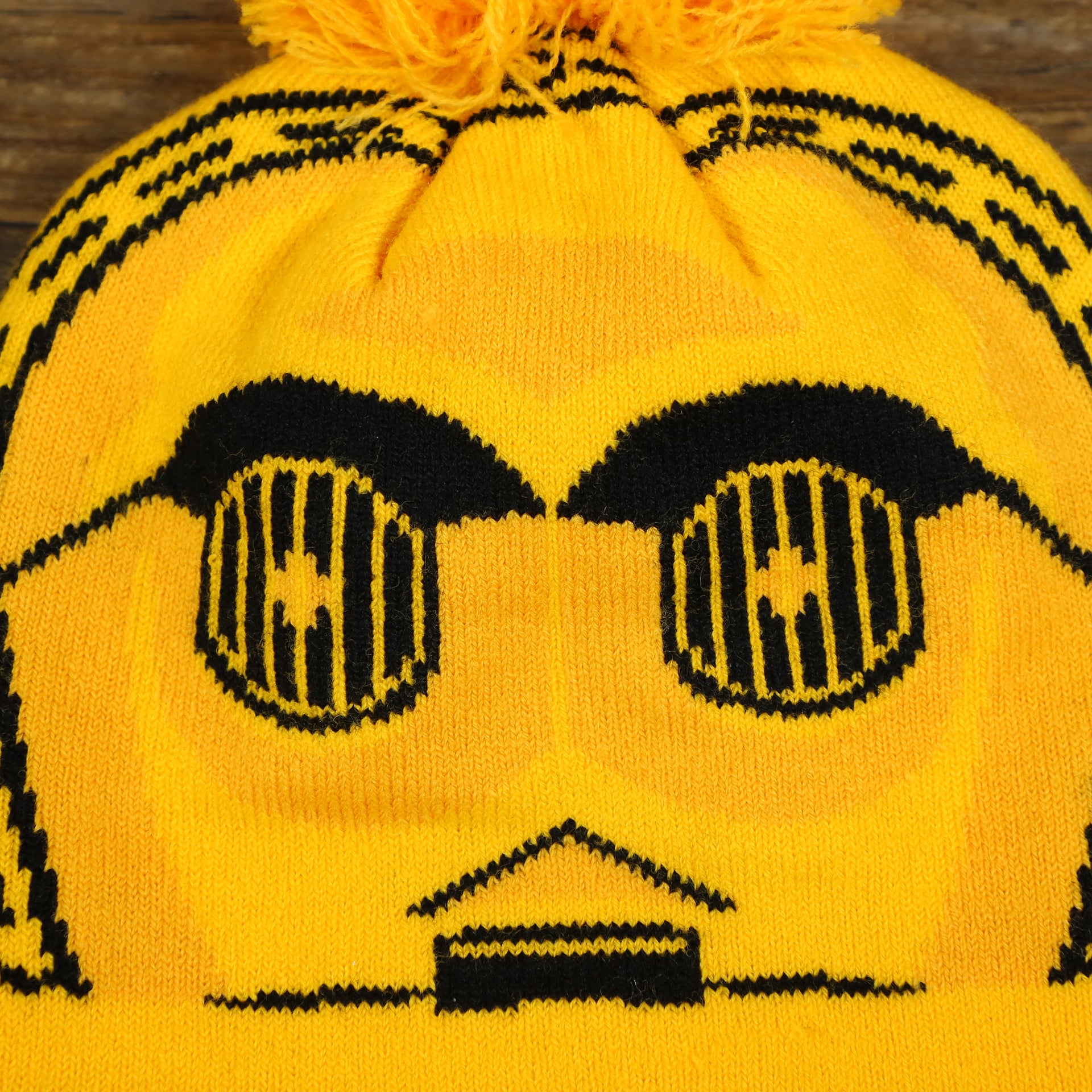 The C3PO Print on the C3PO Rebel Alliance Cuffed Logo Winter Beanie With Pom Pom | Yellow Winter Beanie
