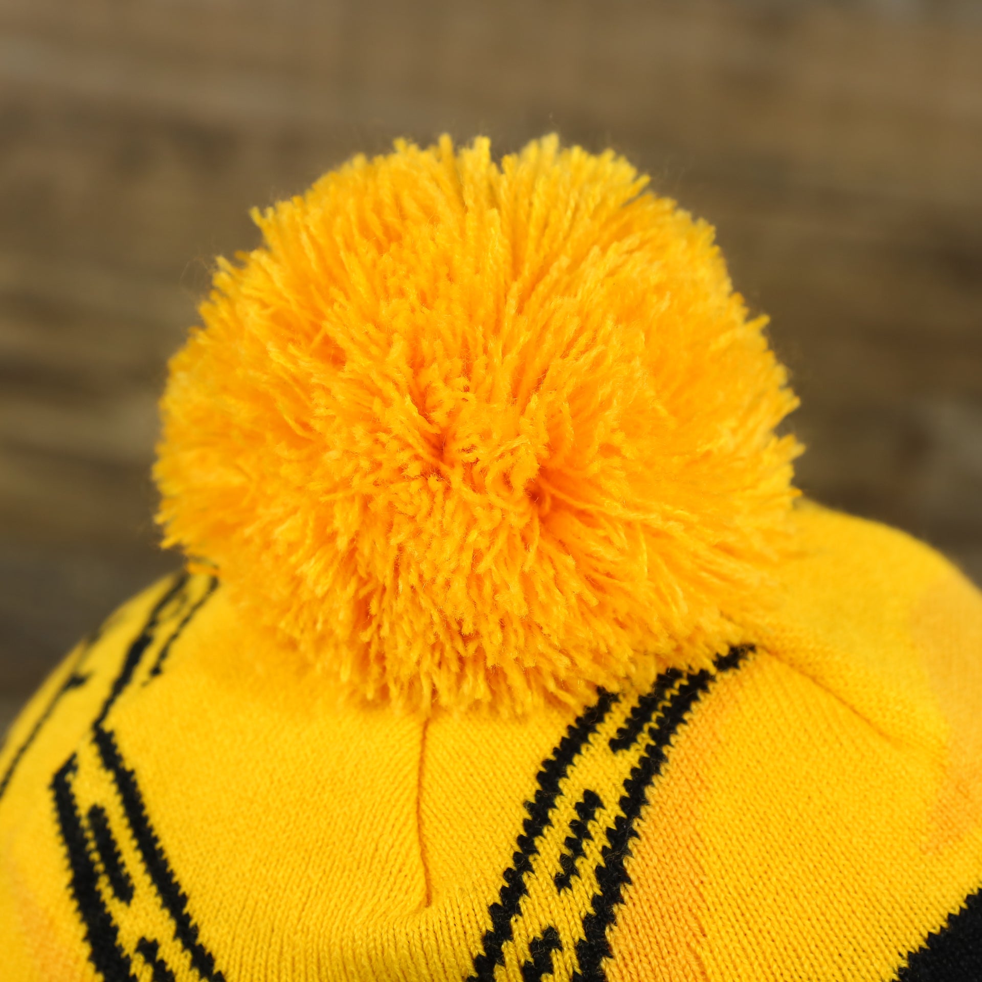 The Pom Pom on the C3PO Rebel Alliance Cuffed Logo Winter Beanie With Pom Pom | Yellow Winter Beanie