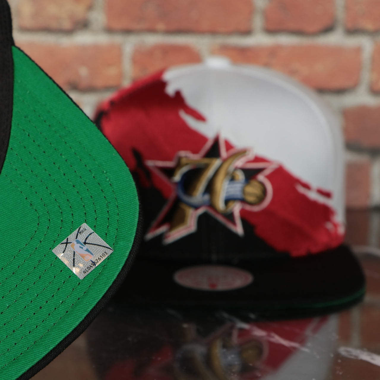 green under visor on the Philadelphia 76ers Vintage Retro NBA Paintbrush Mitchell and Ness Snapback Hat | Black/White/Red