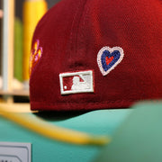 The MLB Batterman Logo on the Cooperstown Philadelphia Phillies All Over Embroidered Chain Stitch Heart Pink Bottom 59Fifty Fitted Cap | Maroon 59Fifty Cap