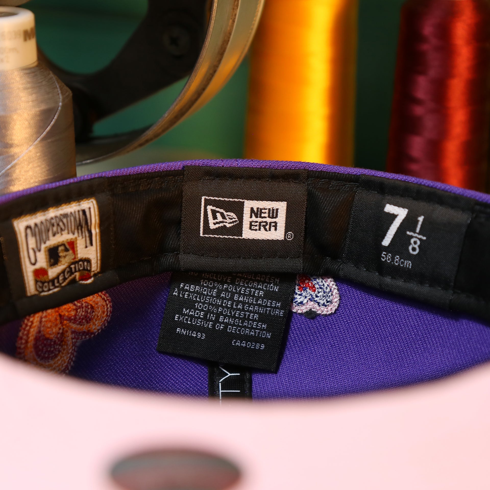 The Tags on the Cooperstown Arizona Diamondbacks All Over Embroidered Chain Stitch Heart Pink Bottom 59Fifty Fitted Cap | Purple 59Fifty Cap