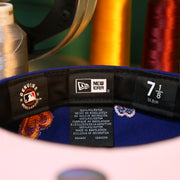 The Tags on the Los Angeles Dodgers All Over Embroidered Chain Stitch Heart Pink Bottom 59Fifty Fitted Cap | Royal Blue 59Fifty Cap