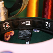 The Tags on the Oakland Athletics All Over Embroidered Chain Stitch Heart Pink Bottom 59Fifty Fitted Cap | Green 59Fifty Cap