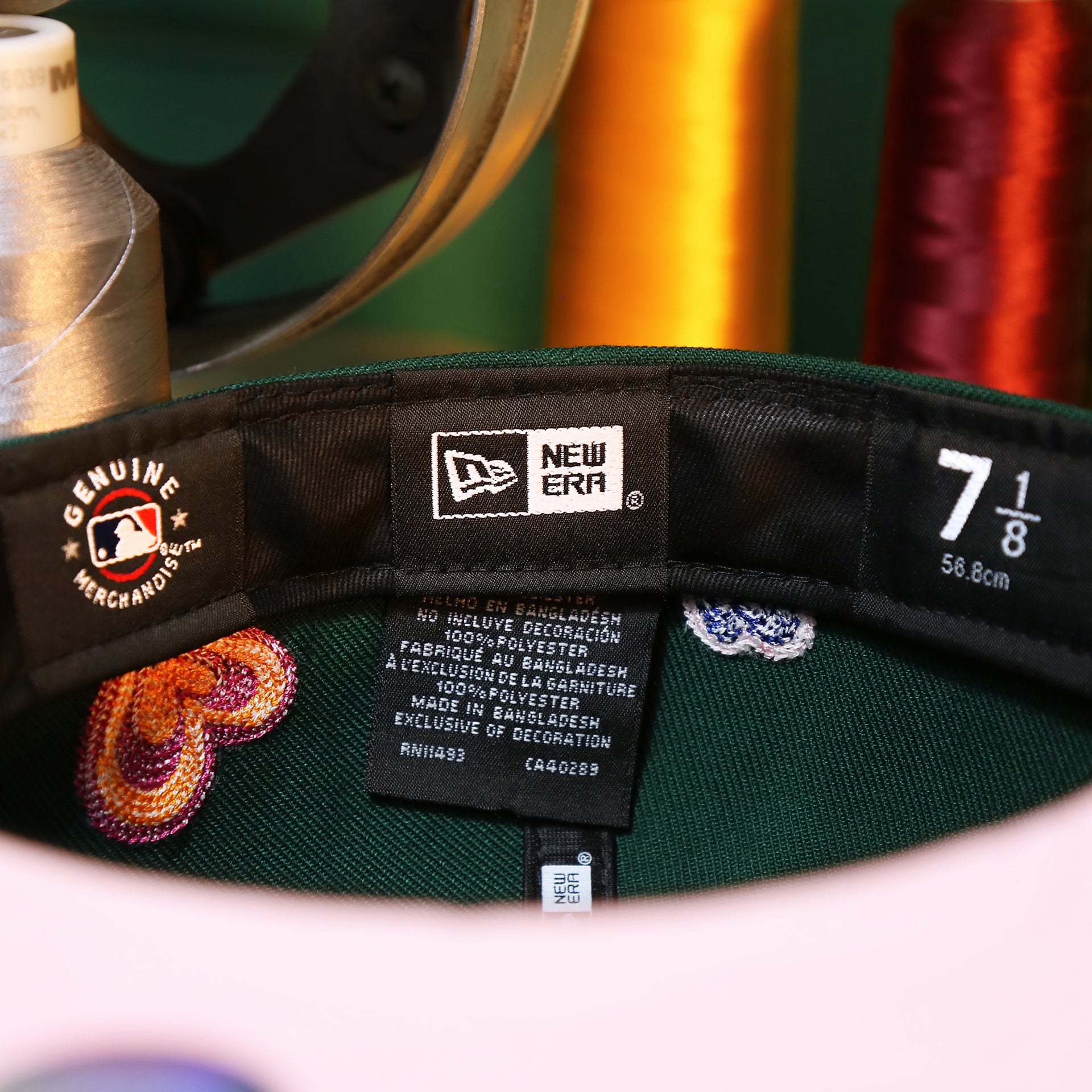 The Tags on the Oakland Athletics All Over Embroidered Chain Stitch Heart Pink Bottom 59Fifty Fitted Cap | Green 59Fifty Cap