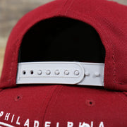 The Grey Adjustable Strap on the Philadelphia Phillies Team Script Gray Bottom 9Fifty Snapback | Maroon And Grey Snap Cap