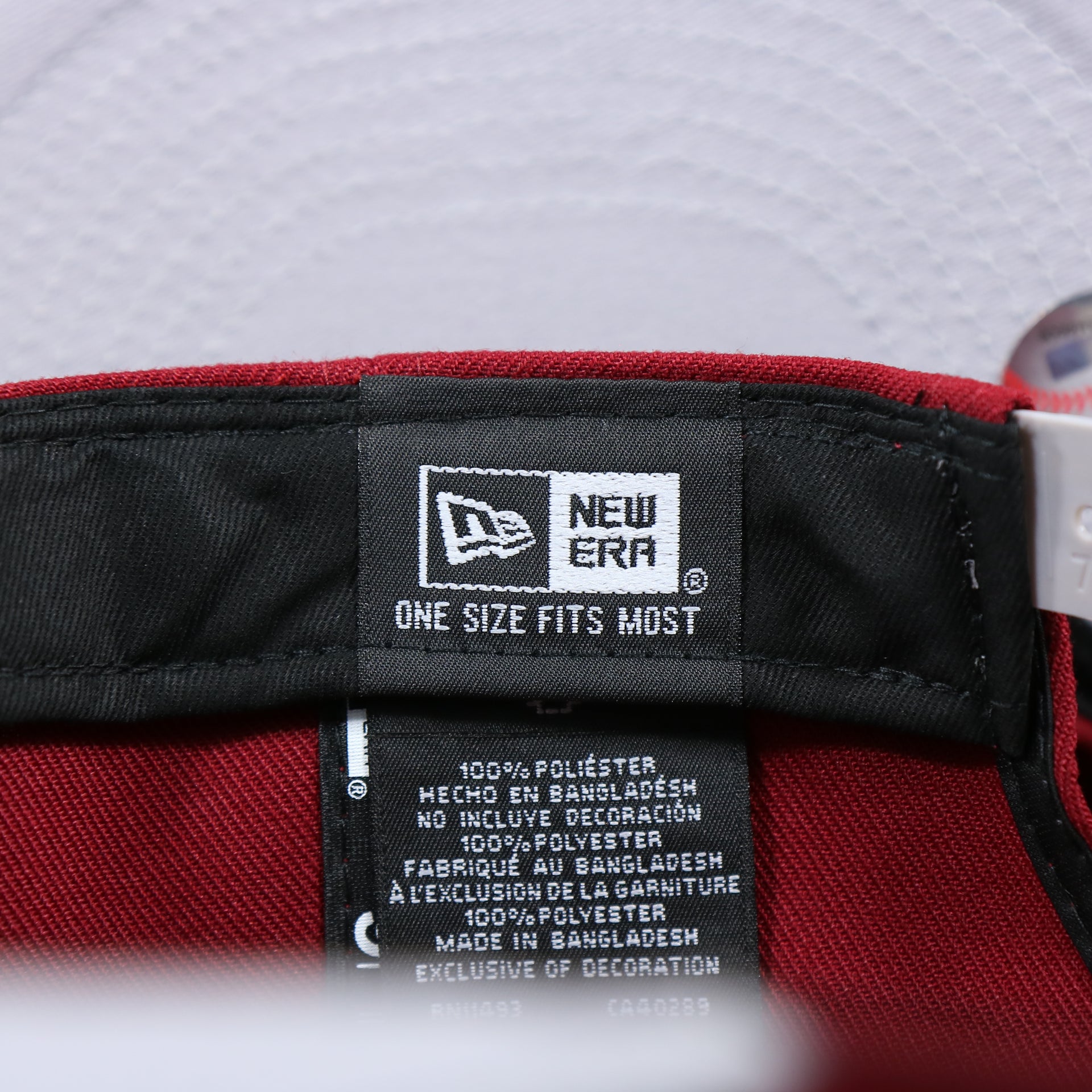 The New Era Tag on the Philadelphia Phillies Team Script Gray Bottom 9Fifty Snapback | Maroon And Grey Snap Cap