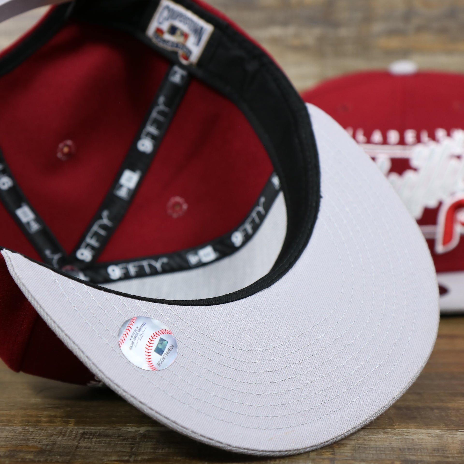 The Gray undervisor on the Philadelphia Phillies Team Script Gray Bottom 9Fifty Snapback | Maroon And Grey Snap Cap