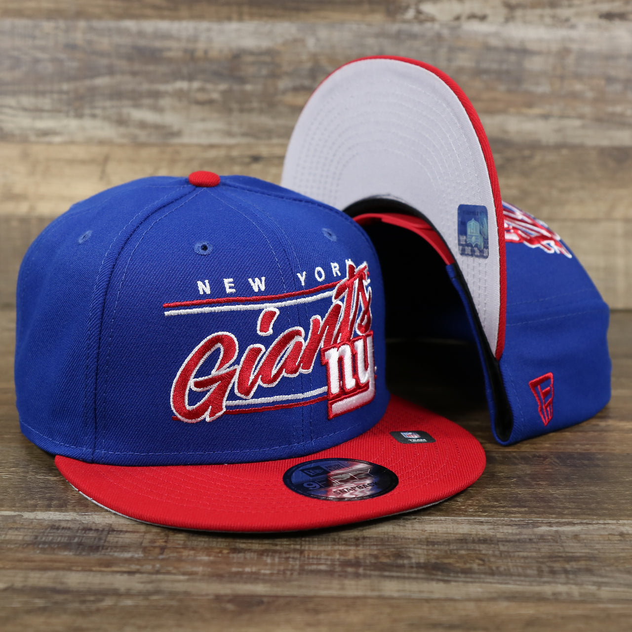 The New York Giants Team Script Gray Bottom 9Fifty Snapback | Royal Blue And Red Snap Cap