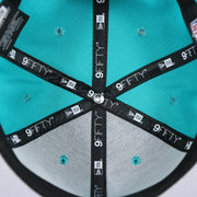 The inside of the Miami Dolphins Team Script Gray Bottom 9Fifty Snapback | Aqua and Orange Snap Cap