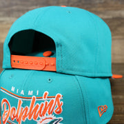 The backside of the Miami Dolphins Team Script Gray Bottom 9Fifty Snapback | Aqua and Orange Snap Cap