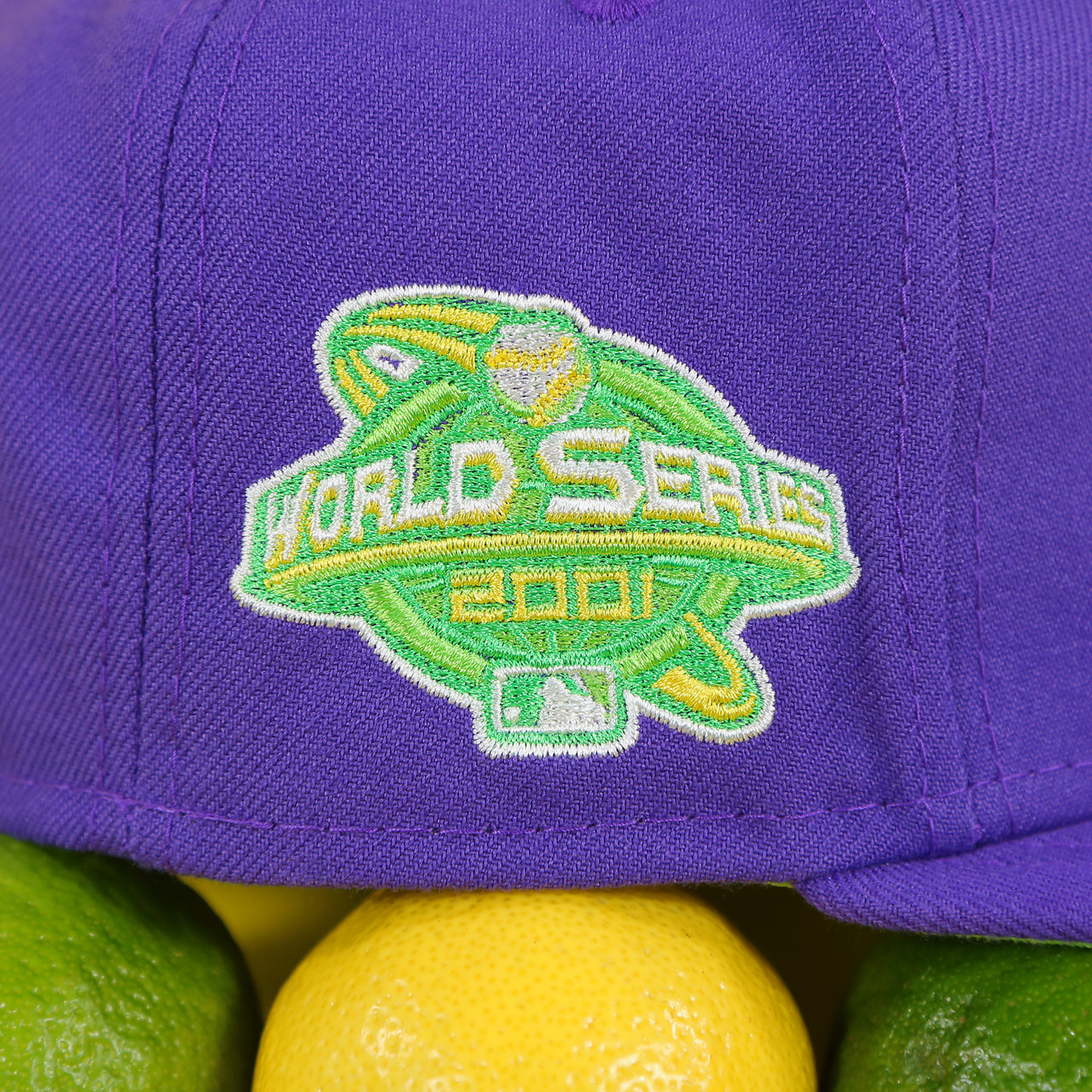 Close up of the 2001 World Series side patch on the Arizona Diamondbacks Cooperstown 2001 World Series Side Patch "Citrus Pop" Green UV 59Fifty Fitted Cap