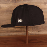 Wearer's left of the Houston Astros Iced Out Side Patch Cactus Texas Flag Gray Bottom 59Fifty Fitted Cap
