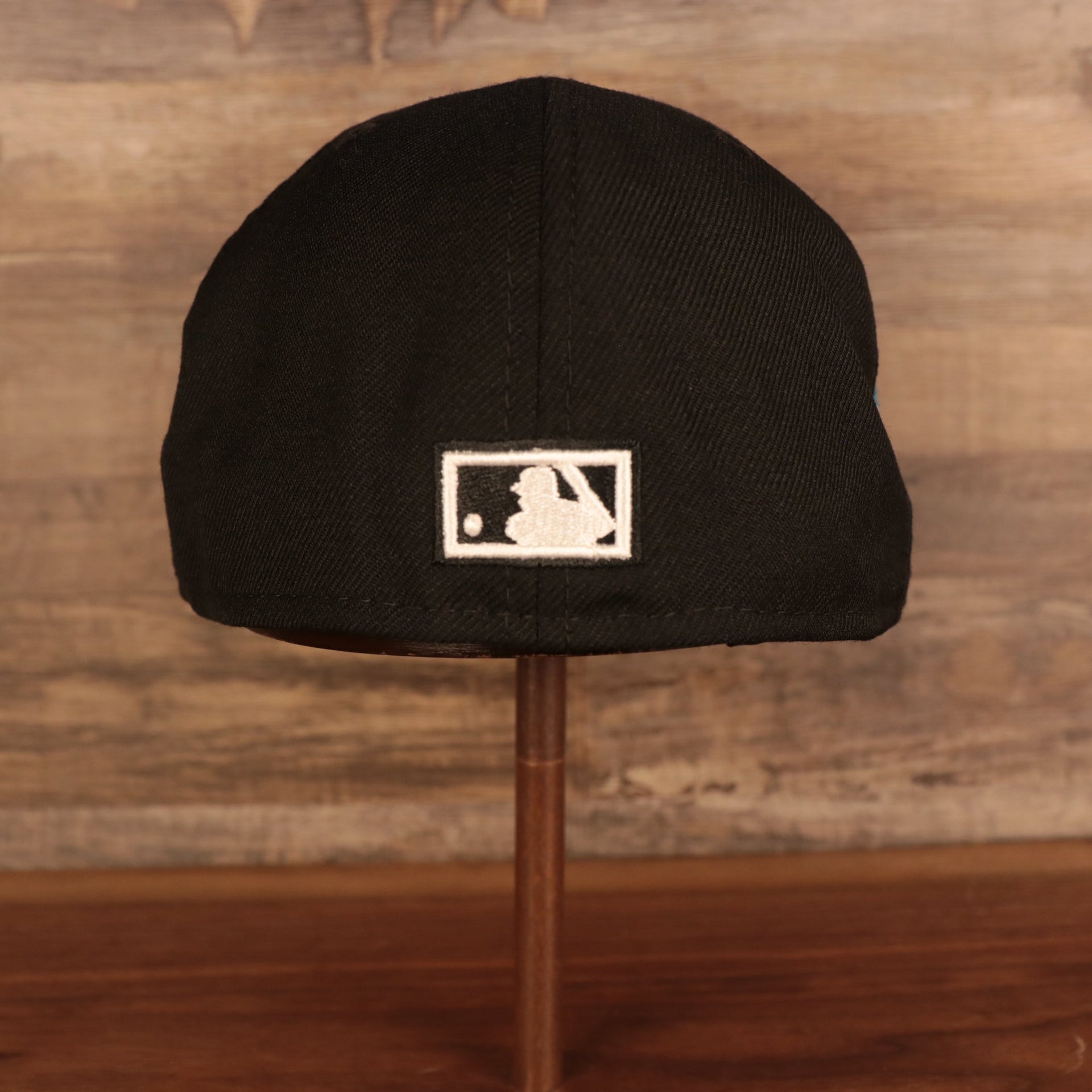Back of the Florida Marlins Retro Cooperstown Iced Out Side Patch Orange Florida Gray Bottom 59Fifty Fitted Cap