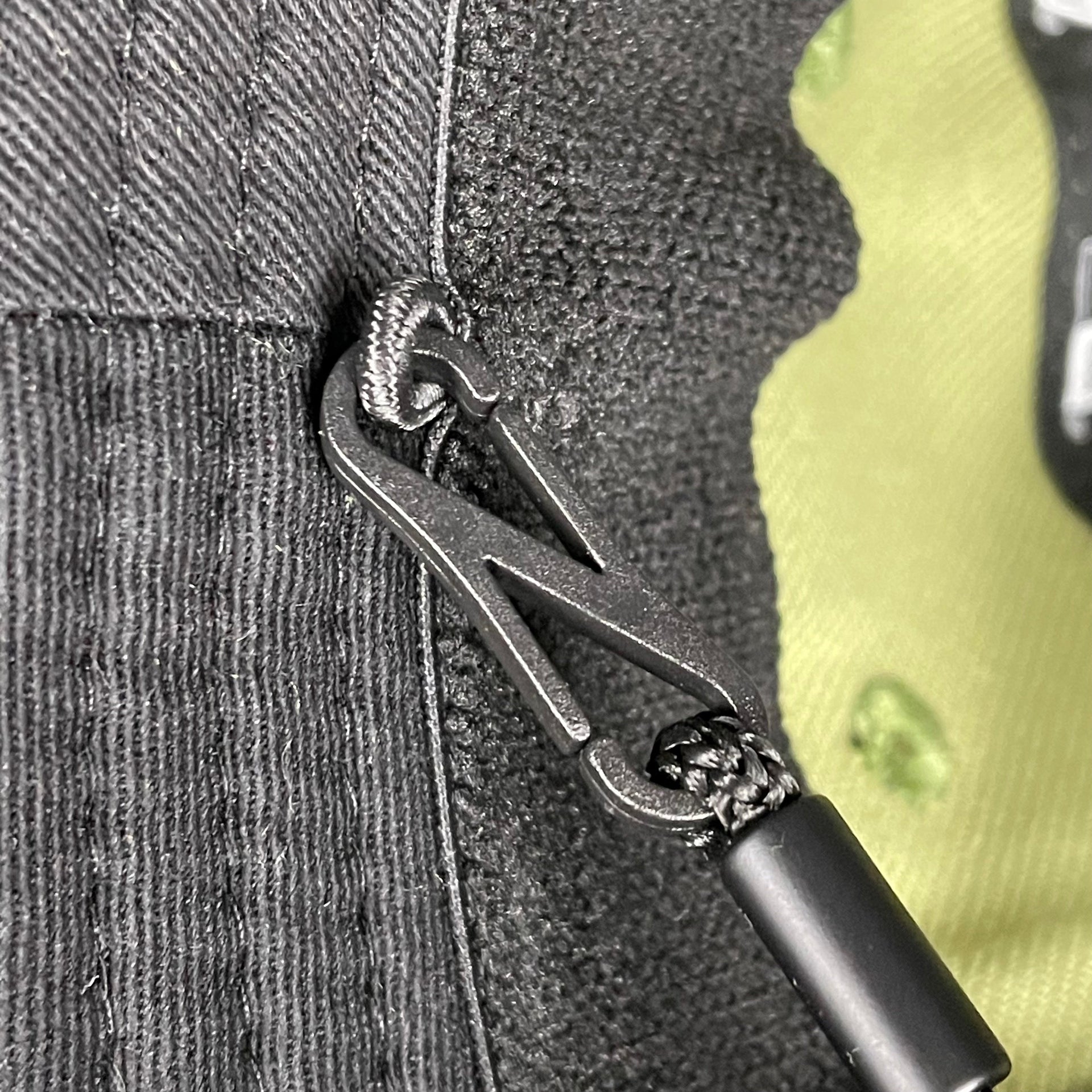 A close up of the removable chin strap on the New York Yankees 2022 Armed Forces Day / Memorial Day Side Patch Boonie Bucket Hat