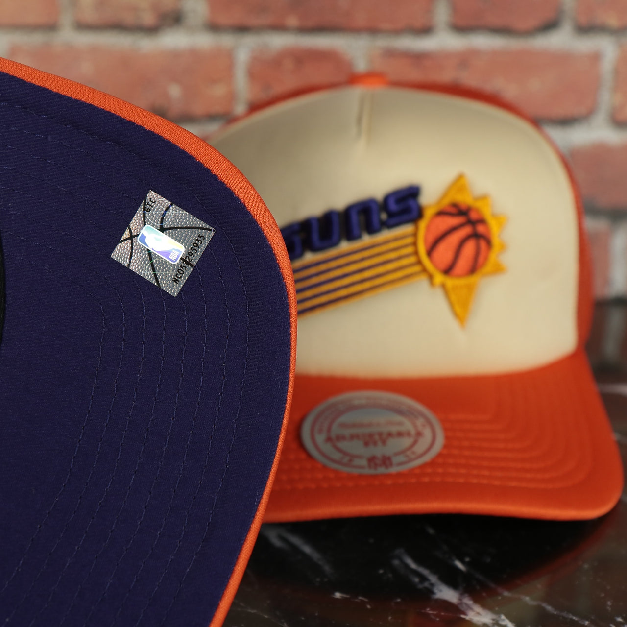 Phoenix Suns Vintage "Phoenix" wordmark Purple Bottom 2-Tone Foam Trucker Hat | Orange/Off-White Mitchell and Ness Hat