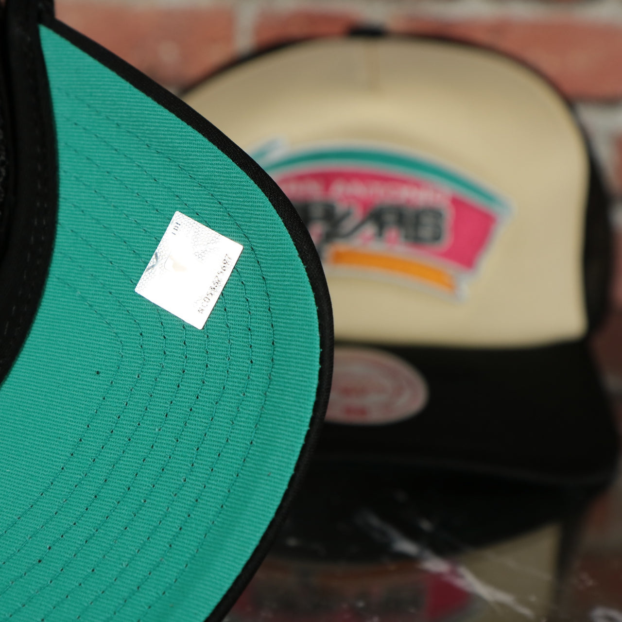 San Antonio Spurs "Spurs" wordmark teal Bottom 2-Tone Foam Trucker Hat | Black/Off-White Mitchell and Ness Hat