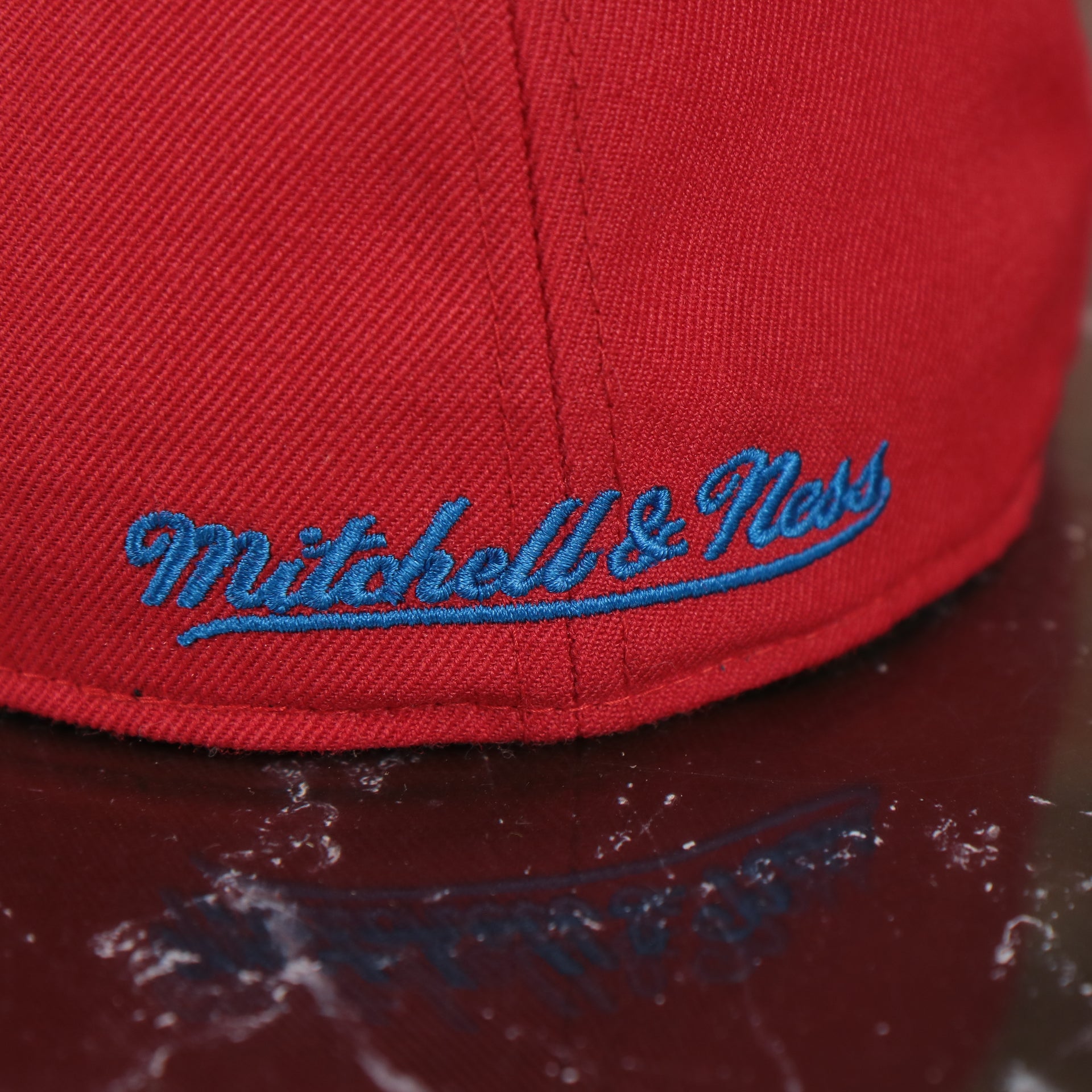 mitchell and ness logo on the Washington Capitals 2-Tone Fitted Cap Green Bottom | Blue/Red Cap