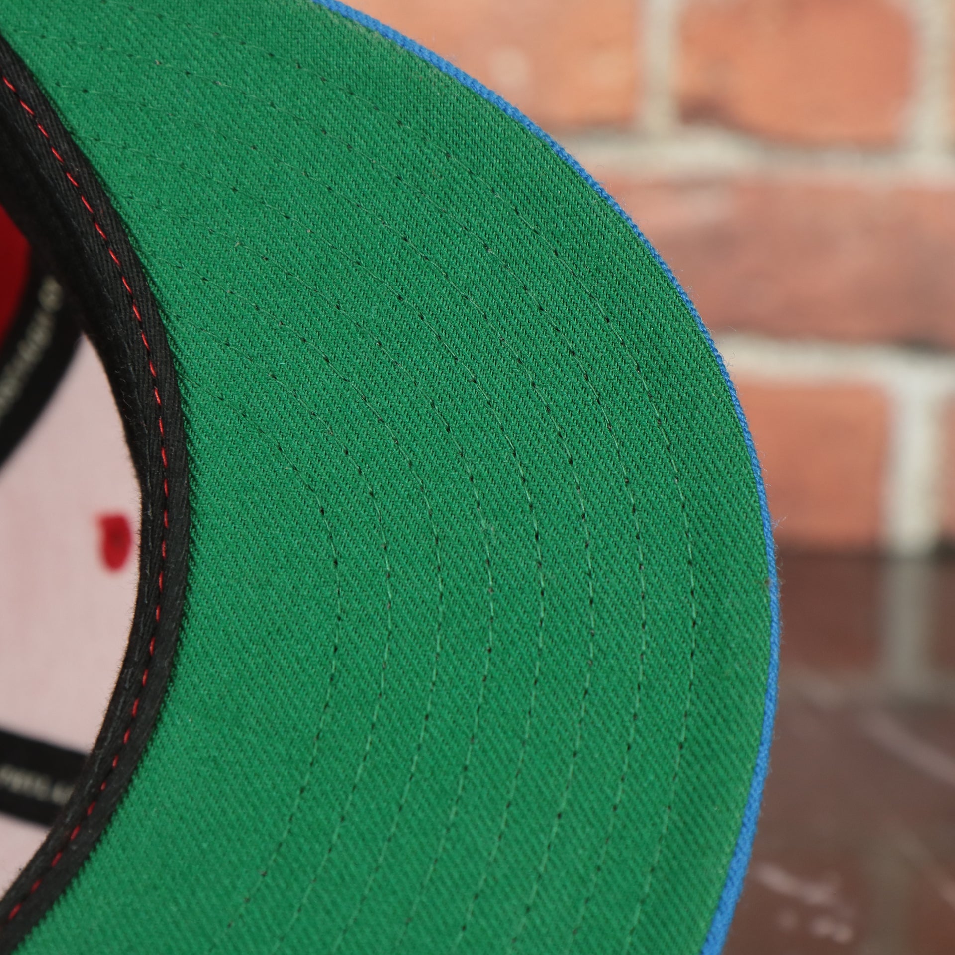 green under visor on the Washington Capitals 2-Tone Fitted Cap Green Bottom | Blue/Red Cap