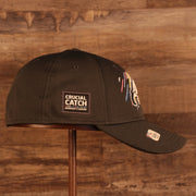 Wearer's right of the Philadelphia Eagles NFL 2021 Crucial Catch Cancer Awareness 39Thirty Stretch Fit Cap