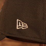 Close up of the New Era logo on the Philadelphia Eagles NFL 2021 Crucial Catch Cancer Awareness 39Thirty Stretch Fit Cap