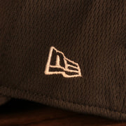 Close up of the New Era logo on the Pittsburgh Steelers NFL 2021 Crucial Catch Cancer Awareness 39Thirty Stretch Fit Cap