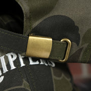 adjustable strap on the Los Angeles Clippers Woodland Camouflage Mitchell and Ness Dad Hat