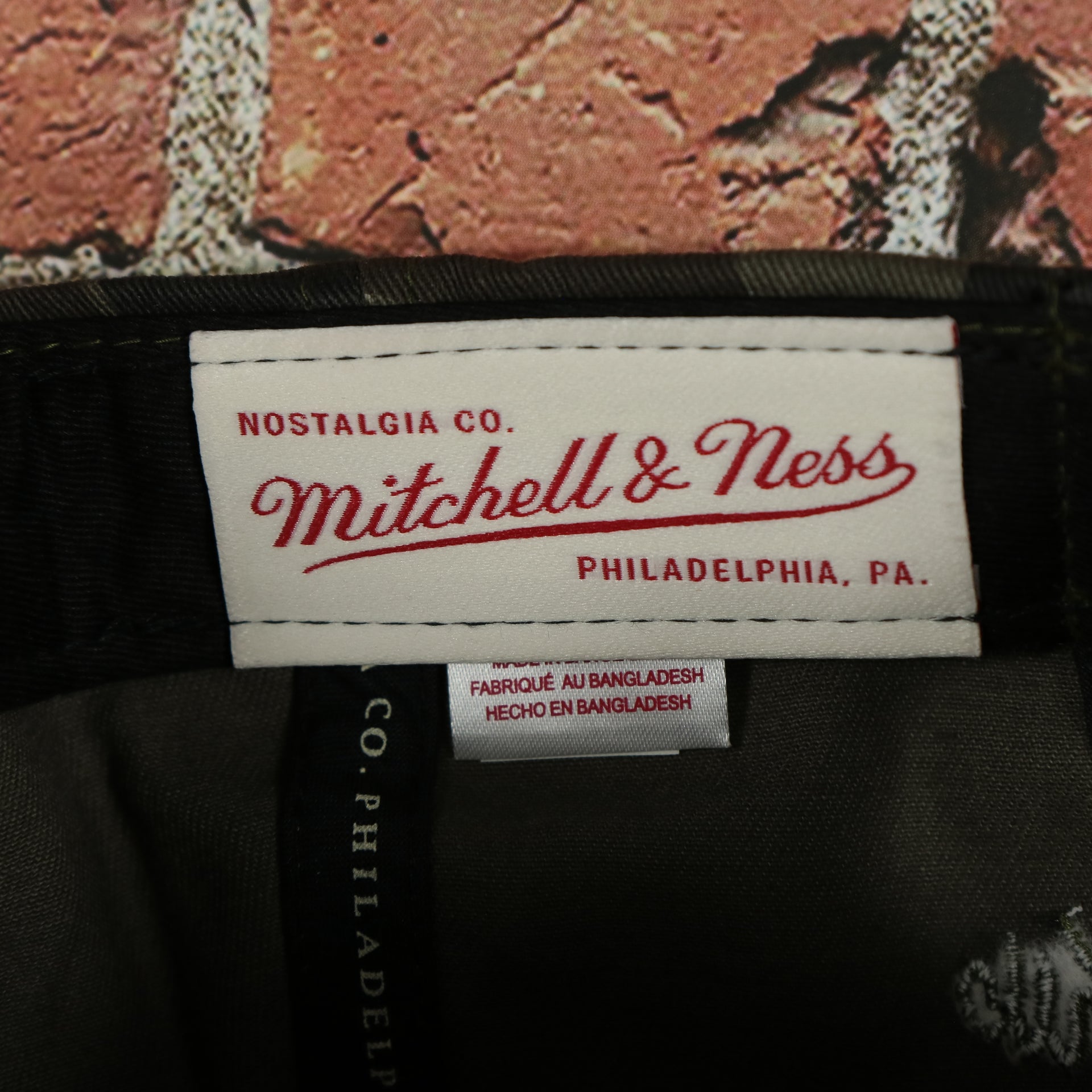 mitchell and ness label on the Los Angeles Clippers Woodland Camouflage Mitchell and Ness Dad Hat