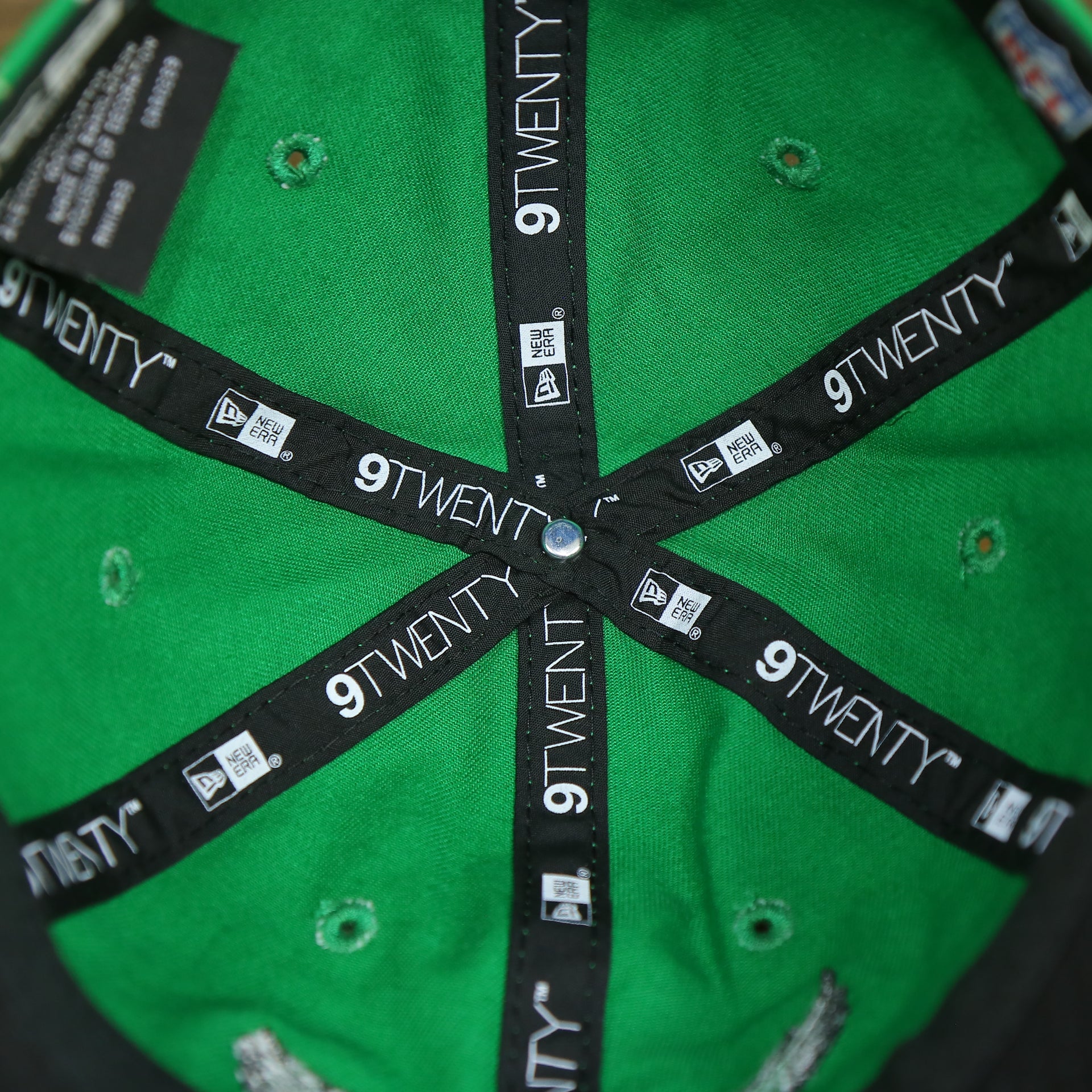 new era 9twenty taping on the Philadelphia Eagles Ladies Throwback Logo Floral Bloom Micro Flower Pattern 9Twenty Dad Hat | Womens Floral Eagles Hat