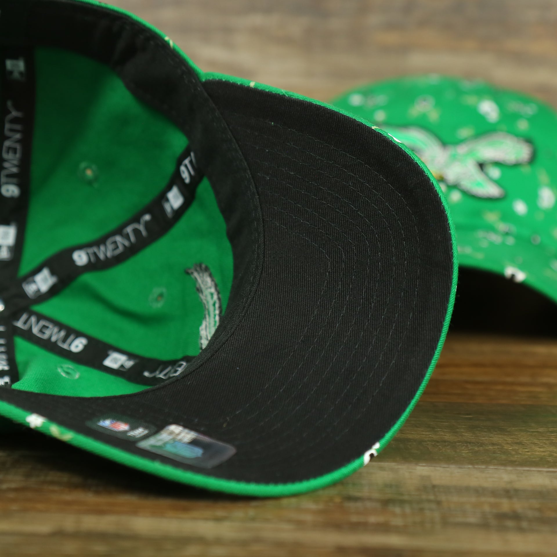 black undervisor on the Philadelphia Eagles Ladies Throwback Logo Floral Bloom Micro Flower Pattern 9Twenty Dad Hat | Womens Floral Eagles Hat