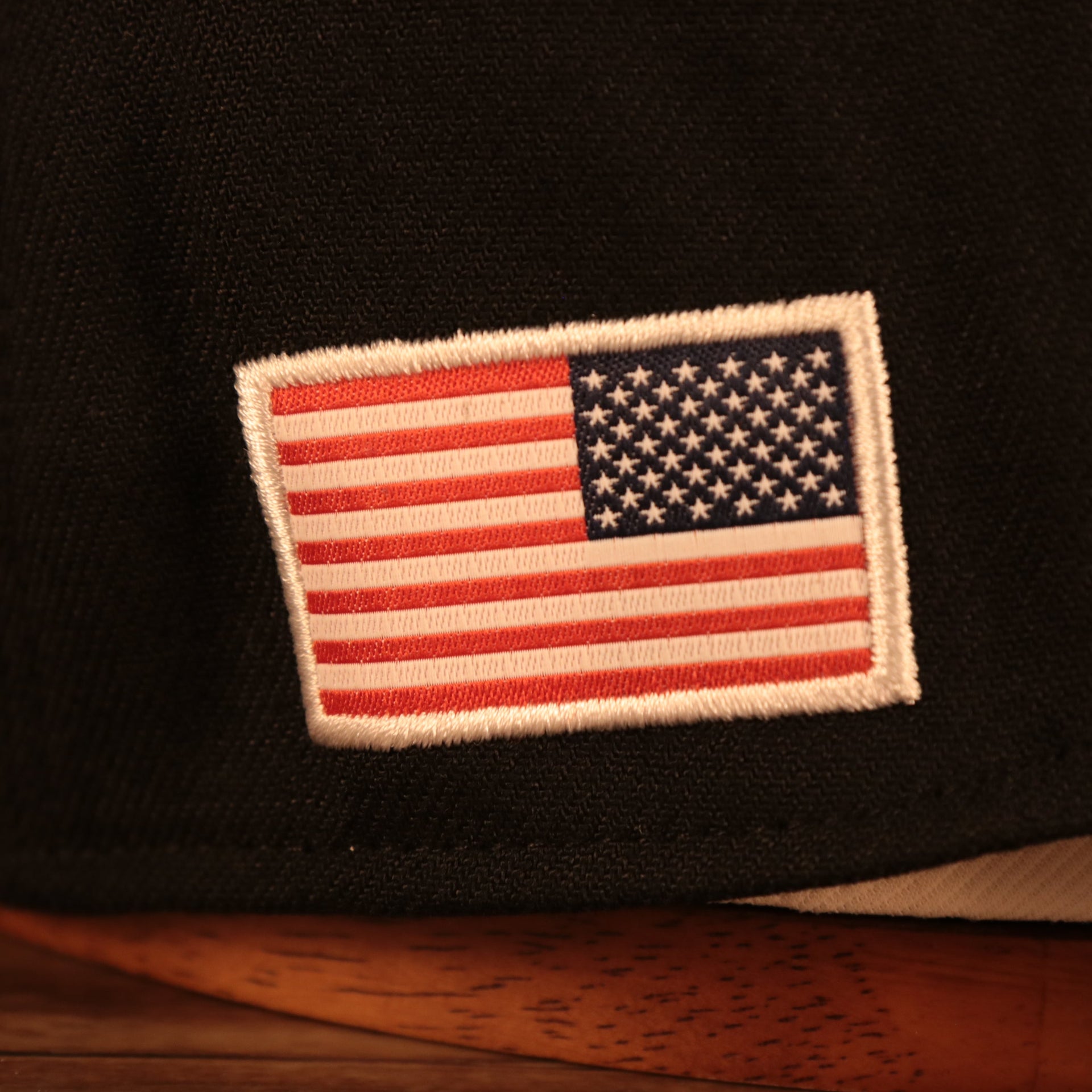 Close up of the US Flag side patch on the Philadelphia Eagles 2021 Salute To Service On Field Sideline 39Thirty Stretch Fit Hat