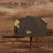 A side profile view of the Milwaukee Bucks 2021 NBA Champions Trophy Locker Room 9Fifty Snapback Hat