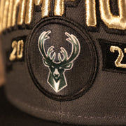 A close up of the Milwaukee Bucks Patch logo on the front of the locker room 2021 NBA Championship Snapback Hat