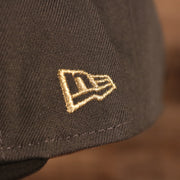 A close up of the New Era flag embroidered in metallic gold on the wearer's left of the Milwaukee Bucks 2021 NBA Champions Trophy Locker Room 9Fifty Snapback Hat