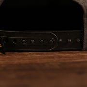 A close up of the black adjustable snap on the 2021 Milwaukee Bucks Champions snapback hat