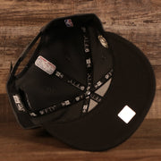 The interior taping of the Milwaukee Bucks 2021 NBA Champions Trophy Locker Room 9Fifty Snapback Hat features the 9FIFTY lettering