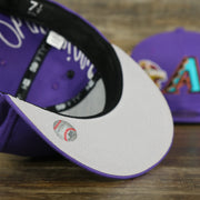grey under visor of the Arizona Diamondbacks Cooperstown All Over Side Patch "Historic Champs" Gray UV 59Fifty Fitted Cap | Purple 59Fifty Fitted Cap
