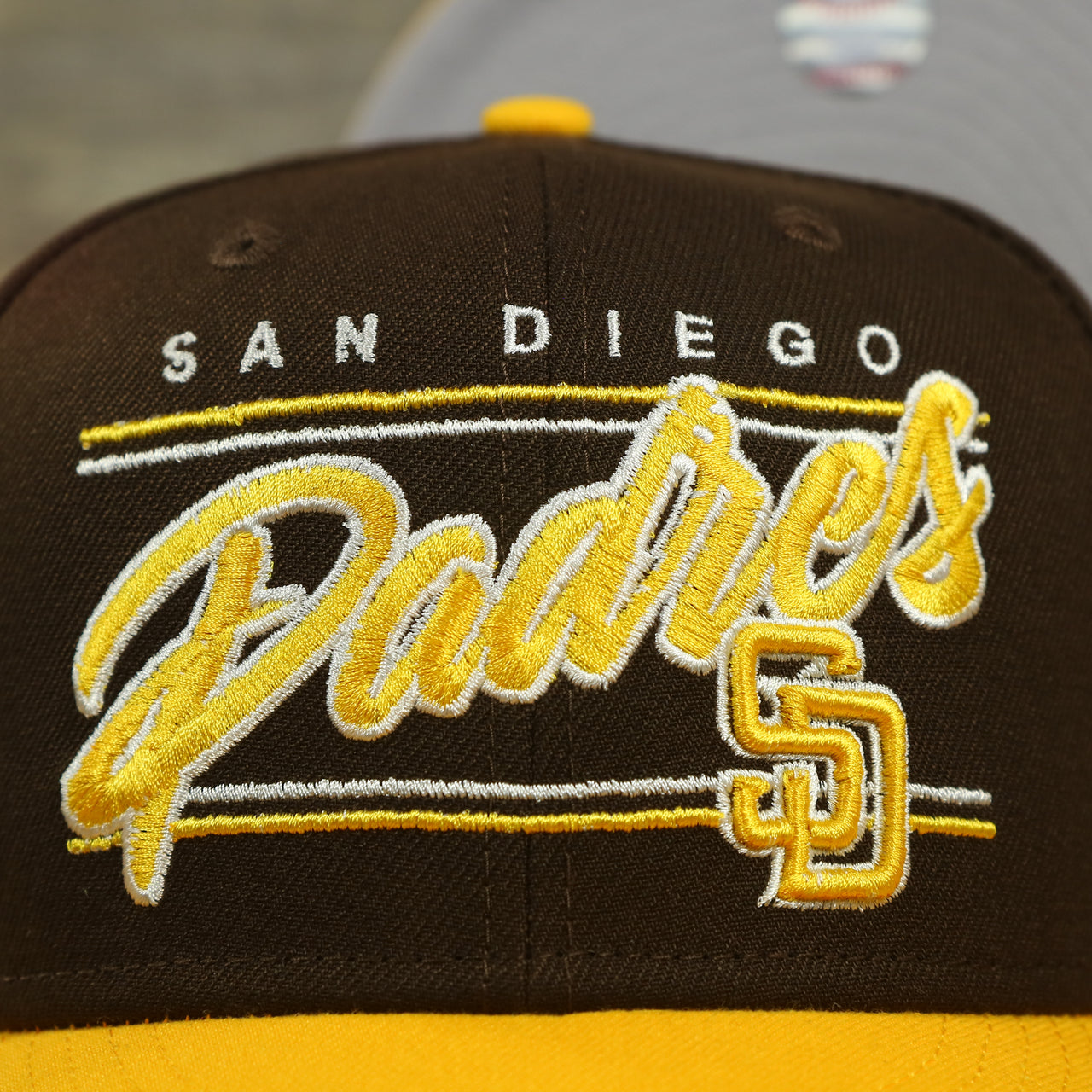 padres logo on the San Diego Padres "Team Script" College Bar 9Fifty Snapback Hat | Brown/Yellow Steelers 950 Snap Cap