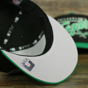 grey under visor on the Philadelphia Eagles Vintage Team Script College Bar Gray Bottom 9Fifty Snapback | Black/Kelly Green Birds 950 Snap Cap