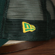 Close up of the New Era logo on the Oakland Athletics 2022 MLB Batting Practice On-Field Spring Training 9Twenty Trucker Dad Hat