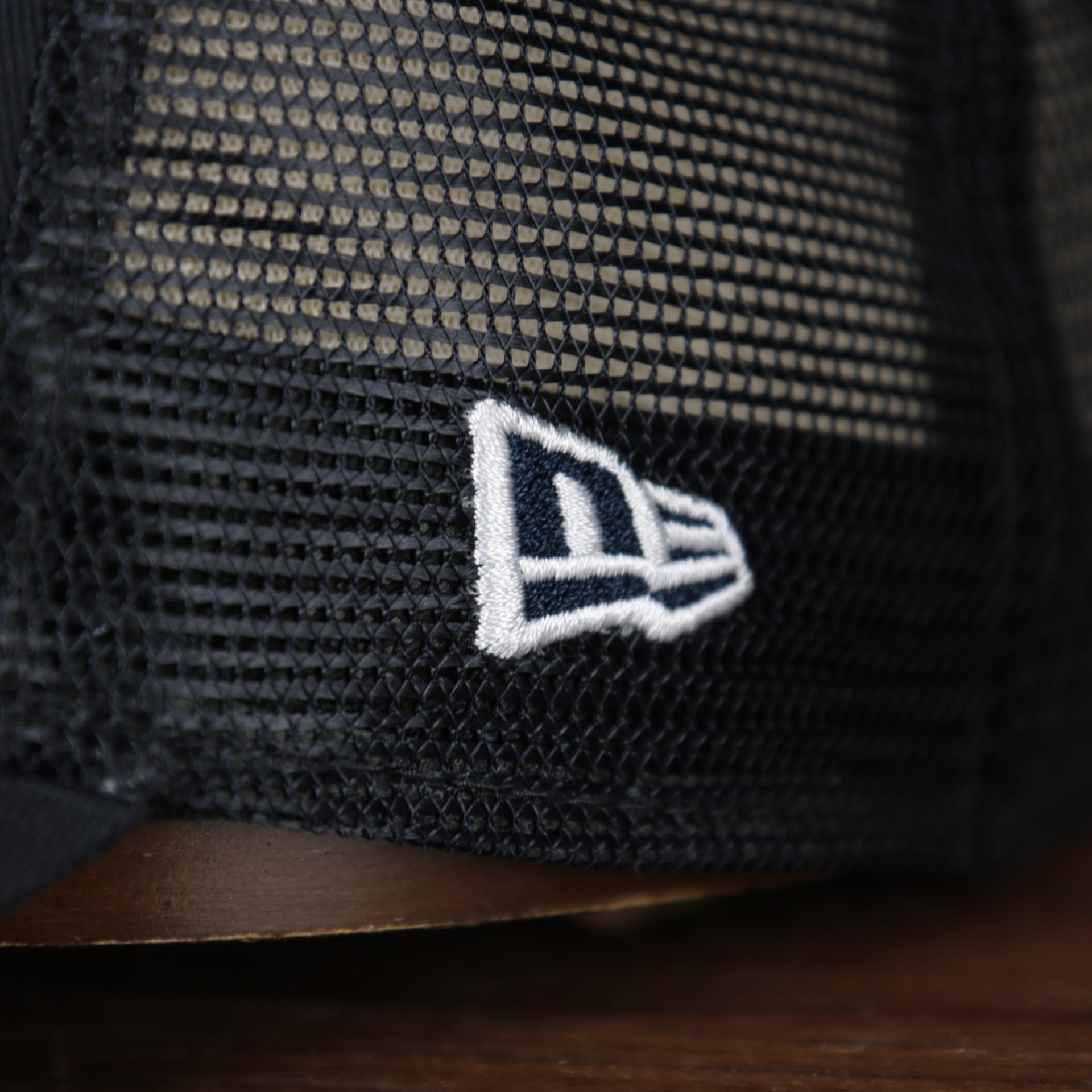 Close up of the New Era logo on the wearer's left of the New York Yankees 2022 MLB Batting Practice On-Field Spring Training 9Twenty Trucker Dad Hat