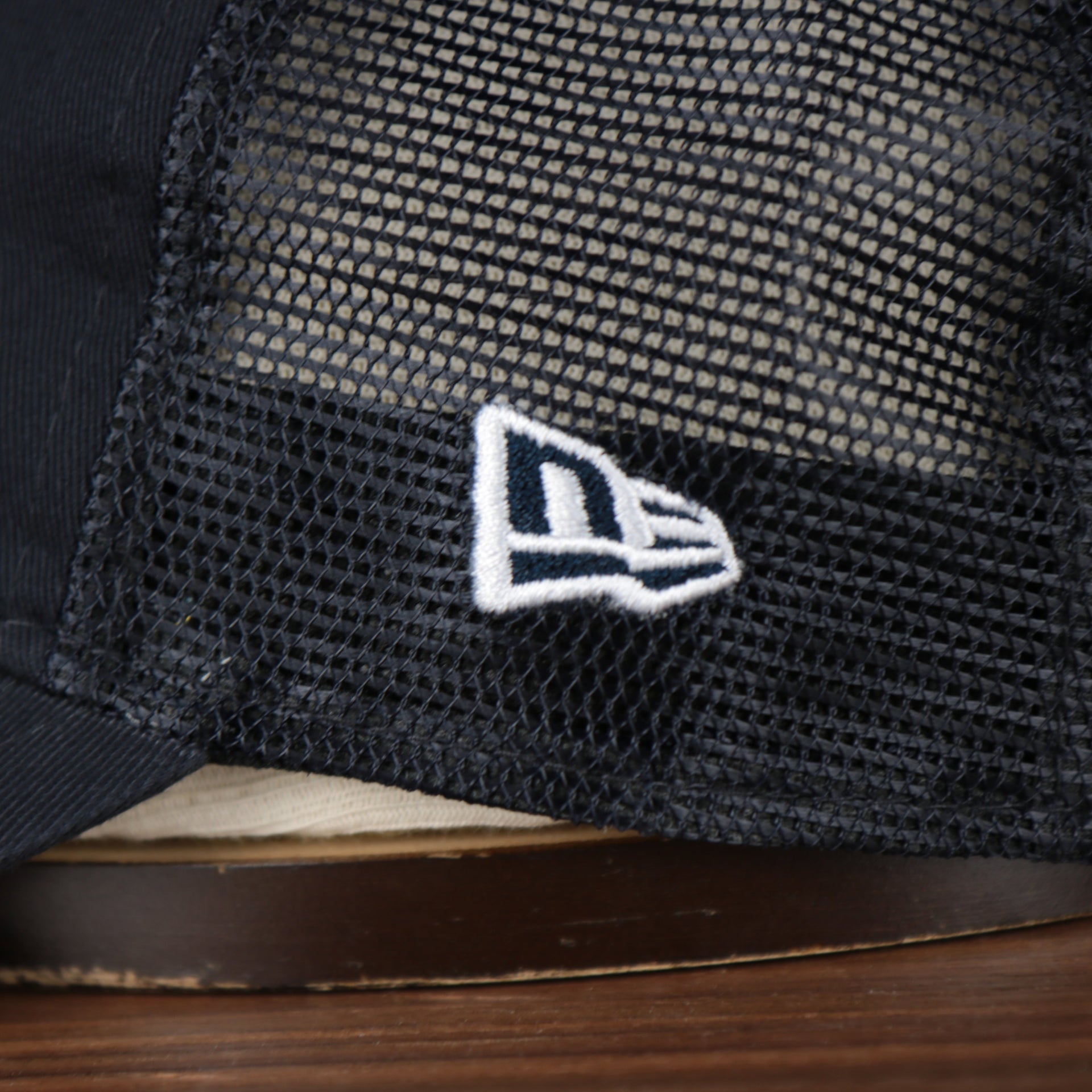 Close up of the New Era logo embroidered on the Detroit Tigers 2022 MLB Batting Practice On-Field Spring Training 9Twenty Trucker Dad Hat