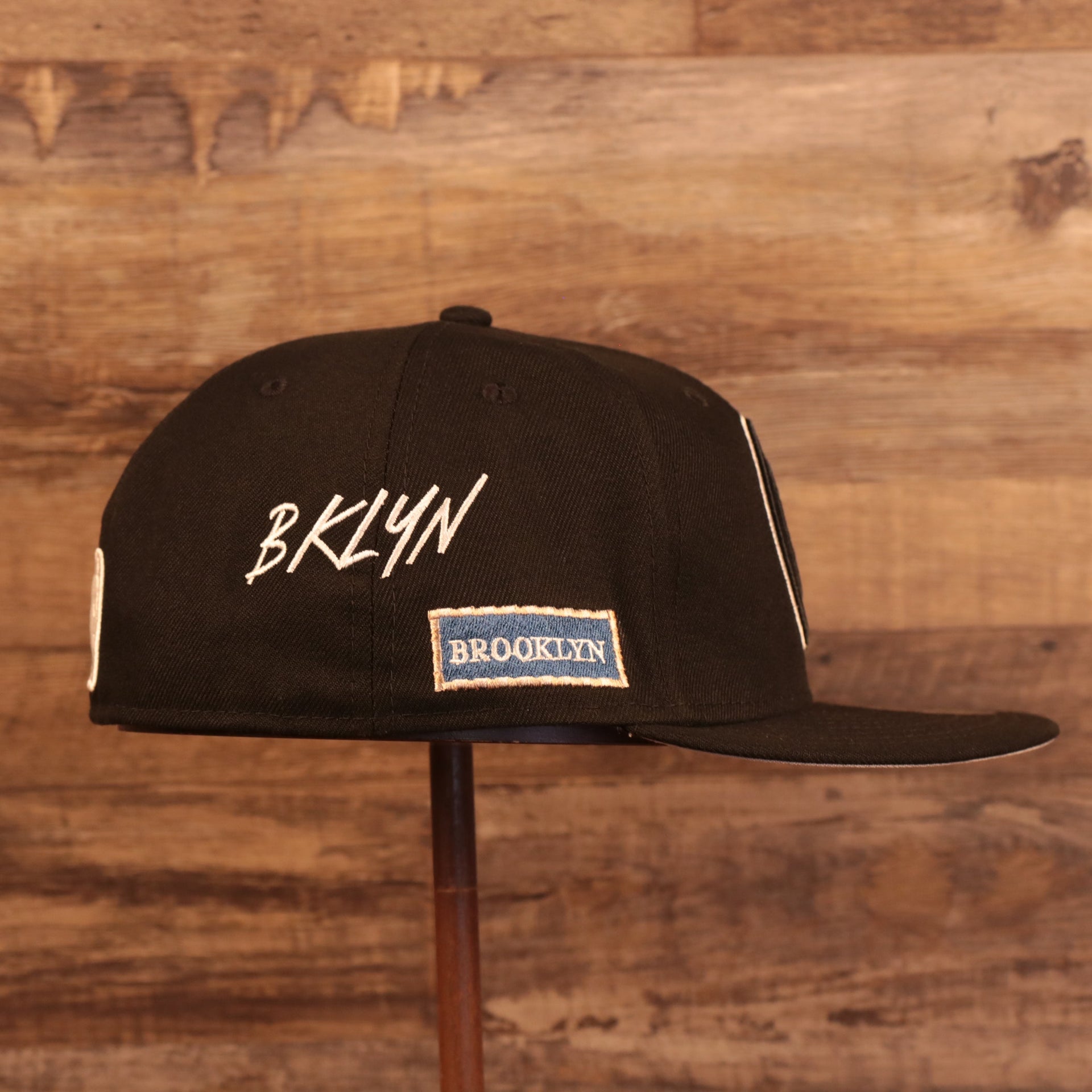 Wearer's right side of the Brooklyn Nets City Transit All Over Side Patch Gray Bottom 59Fifty Fitted Cap