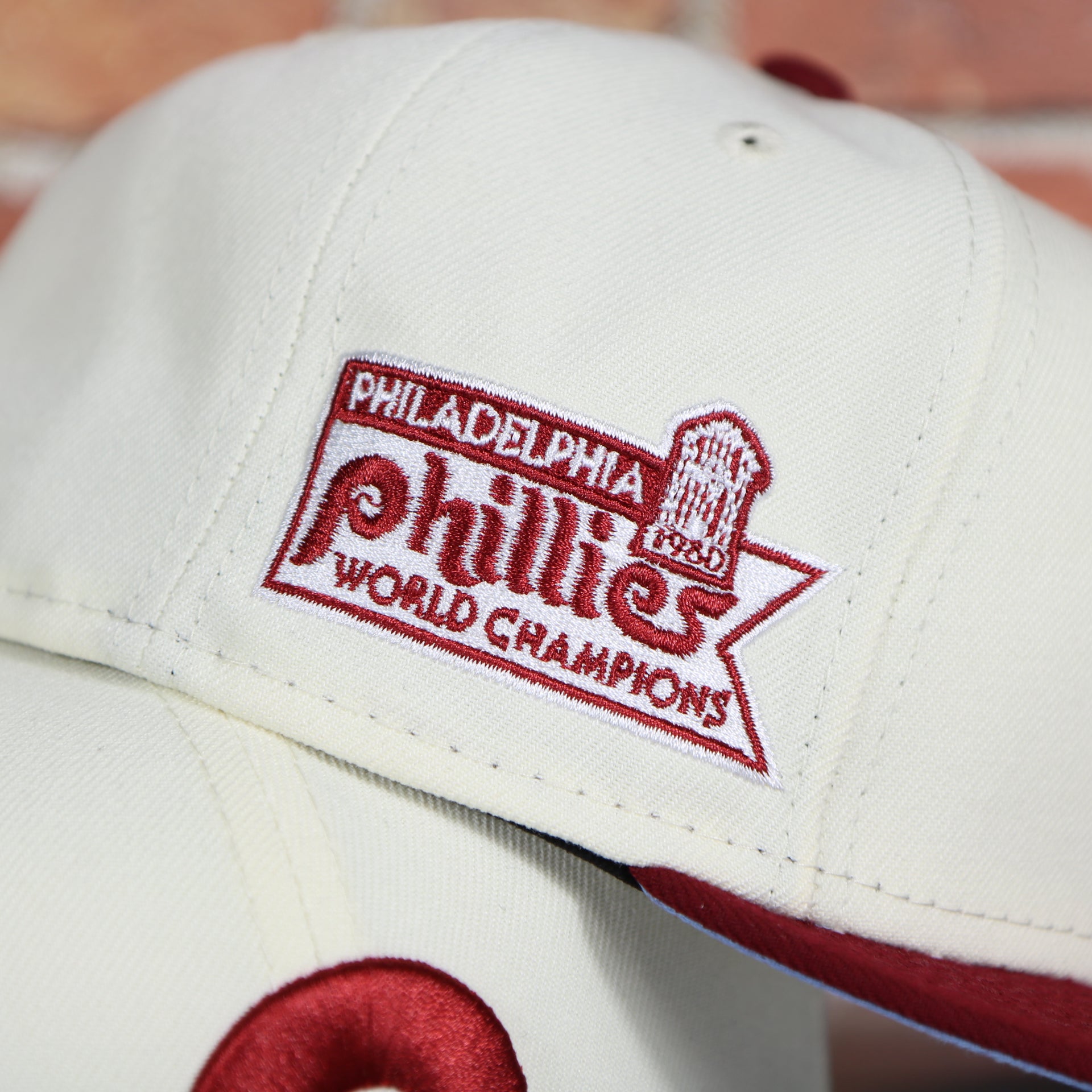 Close up of the 1980 World Champions side patch on the wearer's right of the Philadelphia Phillies Cooperstown Retro Logo 1980 World Series Champion Side Patch Grey UV 59Fifty Fitted Cap | Chrome/Maroon nohiosafariclub Exclusive