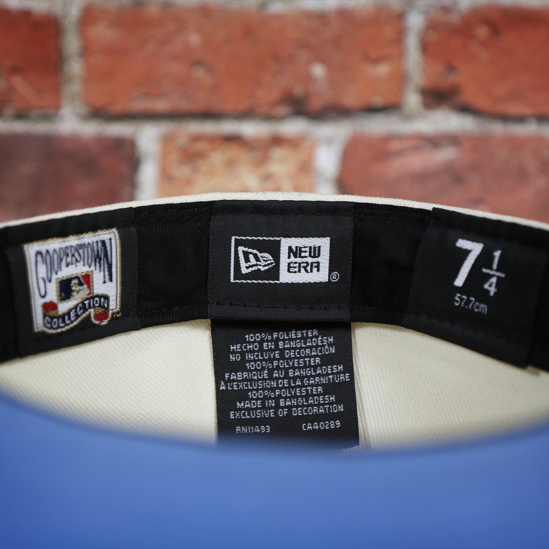 Labels on the interior of the Philadelphia Phillies Cooperstown City Hall Logo Veterans Stadium Side Patch Powder Blue UV 59Fifty Fitted Cap | Chrome/Maroon Cap Swag Exclusive