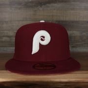 front of the Philadelphia Phillies 1980 World Series Glow In The Dark Pink Brim 59fifty Cap | Maroon