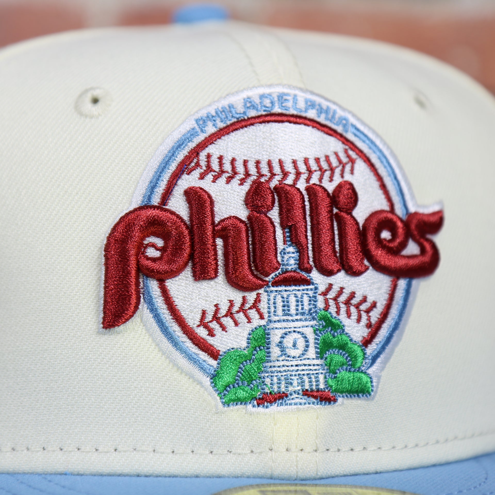 Close up of the city hall logo on the Philadelphia Phillies Cooperstown City Hall Logo Veterans Stadium Side Patch Grey UV 59Fifty Fitted Cap | Chrome/Powder Blue Cap Swag Exclusive